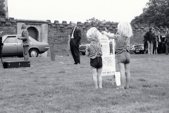 Spectators-sitting-by-the-wall-of-the-Trinity-Hospital-at-a-Silver-Band-concert-on-the-Top-Green-Long-Melford-early-1970_s....