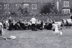 Spectators-sitting-by-the-wall-of-the-Trinity-Hospital-at-a-Silver-Band-concert-on-the-Top-Green-Long-Melford-early-1970_s..