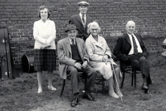 Spectators-sitting-by-the-wall-of-the-Trinity-Hospital-at-a-Silver-Band-concert-on-the-Top-Green-Long-Melford-early-1970_s.